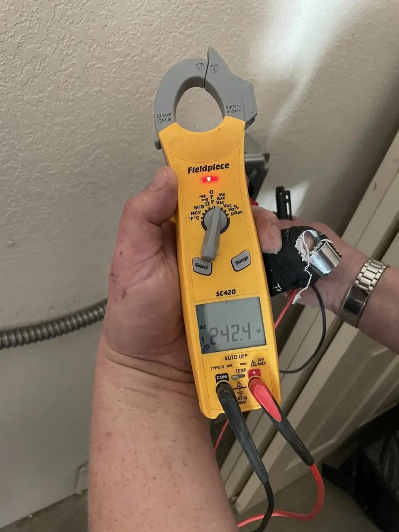 Voltage testing with clamp meter during Recessed Lighting Installation in Elk Ridge